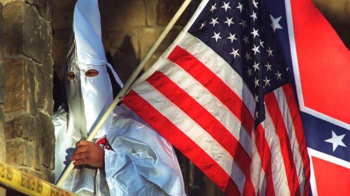 The Loyal White Knights of the Ku Klux Klan put fliers on vehicles at a high school football game. The fliers referenced how banning the Confederate flag would be an “attack on the white race and America.”