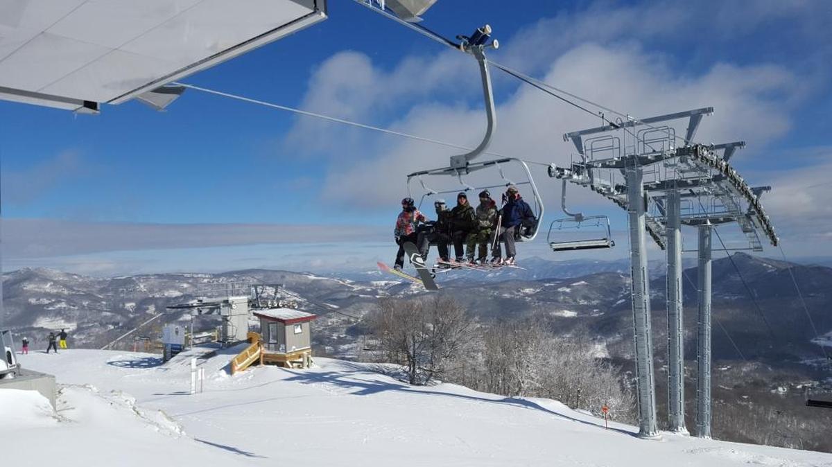 Skiers ride the lift at Sugar Mountain Resort on Feb. 11, 2016, three days before a youth said he was stranded on a lift and suffered broken bones jumping 30 feet.
