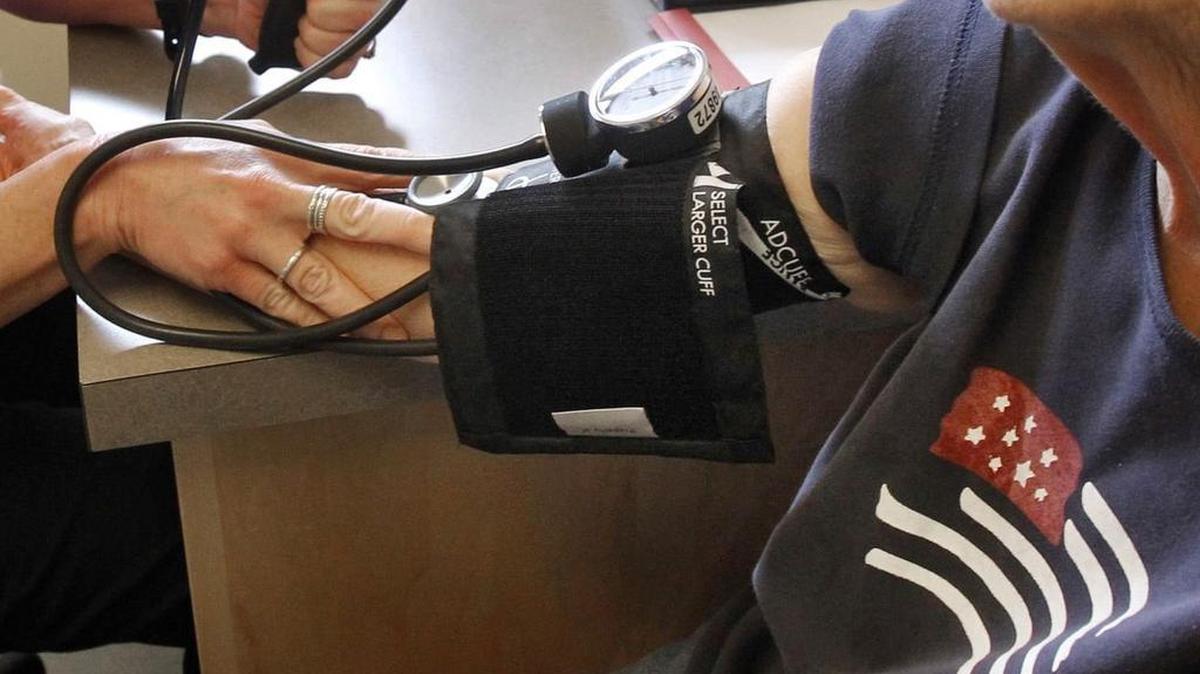 FILE - In this Thursday, June 6, 2013, file photo, a patient has her blood pressure checked by a registered nurse in Plainfield, Vt. (AP Photo/Toby Talbot, File)