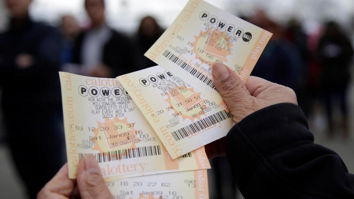 FILE - In this Jan. 9, 2016 file photo, Powerball tickets are shown in San Lorenzo, Calif. No ticket matched all six Powerball numbers following the drawing for a record jackpot of nearly $950 million, lottery officials said early Sunday, Jan. 10, boosting the expected payout for the next drawing to a whopping $1.3 billion.