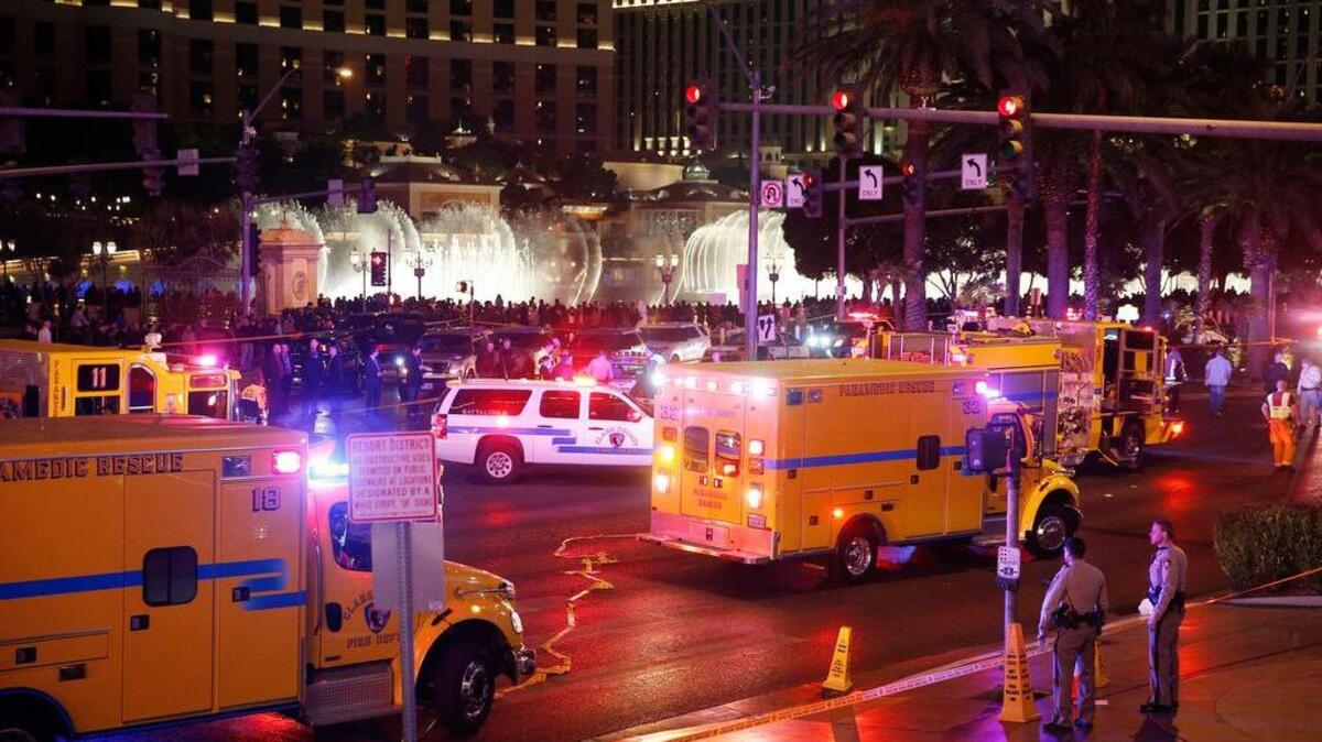 Police and emergency crews respond to the scene of an incident along Las Vegas Boulevard, Sunday, Dec. 20, 2015, in Las Vegas. A woman intentionally swerved her car onto a busy sidewalk two or three times Sunday and mowed down people outside a casino, killing one person and injuring at least 30 others, police said.