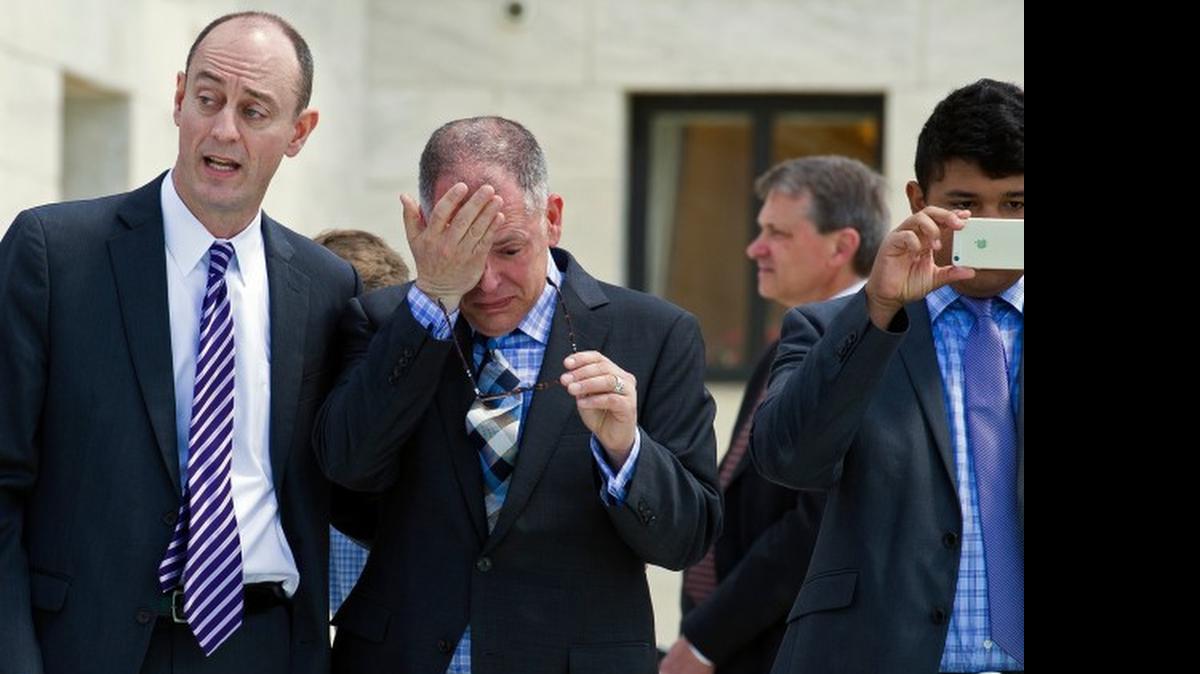 
Plaintiff James Obergefell exits the Supreme Court. James Esseks, director of the ACLU Lesbian and Gay Bisexual Transgender & AIDS project is at left.
