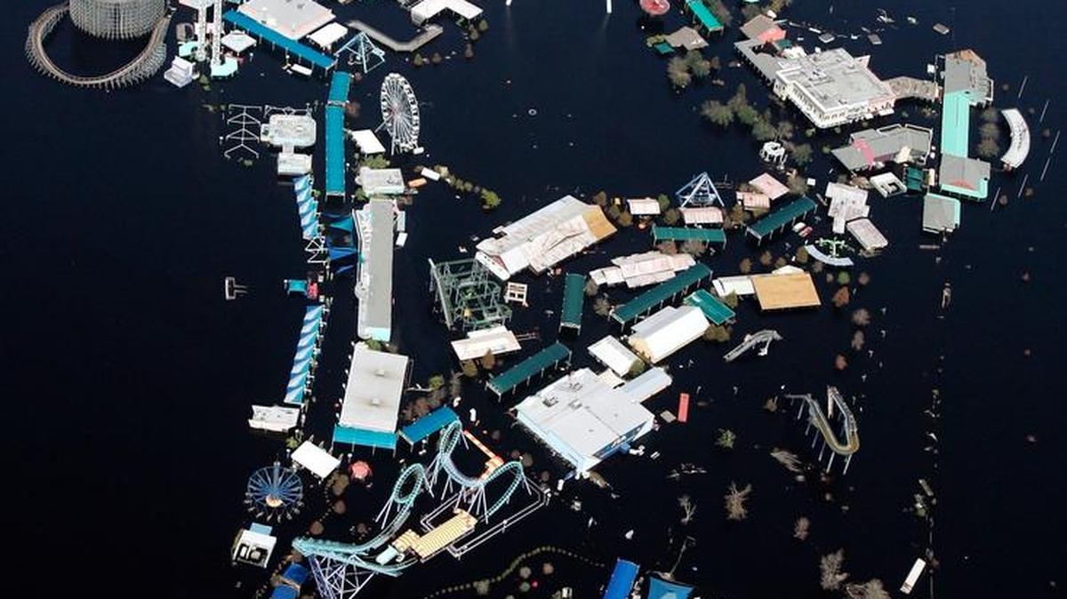 In this Sept. 11, 2005, aerial file photo, Six Flags Great Adventure Amusement Park is surrounded by floodwaters in the aftermath of Hurricane Katrina in New Orleans. Developers want to bring life back the rusting and ghostly theme park on the edge of the swamps outside New Orleans more than 10 years after it was abandoned when Hurricane Katrina left it underwater. On Tuesday, April 12, 2016, two groups of developers again urged the city to help them revive the site, once run by Six Flags and called the Jazzland amusement park.