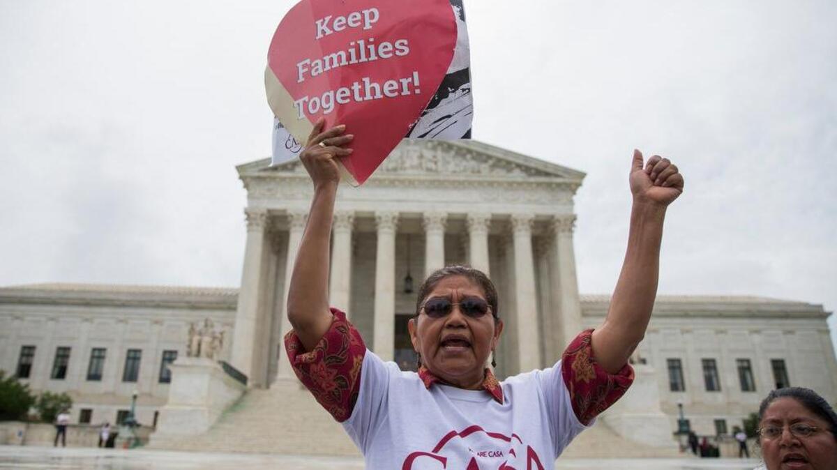 Antonio Surco of Silver Spring, Md. participates in a demonstration outside the Supreme Court in Washington, Thursday, June 23, 2016.