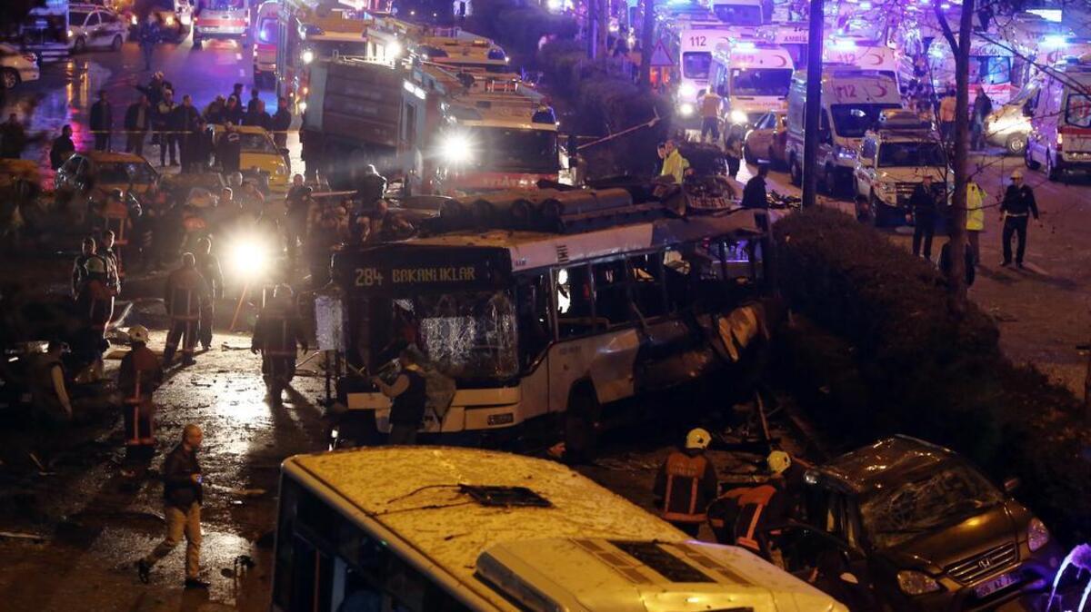 Emergency services work at the explosion site in the busy center of Turkish capital, Ankara, Turkey, Sunday, March 13, 2016. The explosion is believed to have been caused by a car bomb that went off close to bus stops. News reports say the large explosion in the capital has caused several deaths and many casualties.