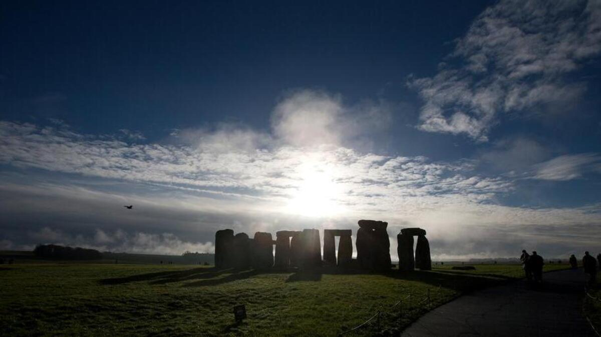 
In this Tuesday Dec. 17, 2013 file photo, visitors take photographs of the world heritage site of Stonehenge, England. Researchers have discovered evidence of standing stones believed to be the remnants of a major prehistoric stone monument near the Stonehenge ruins. University of Bradford researchers said Monday Sept. 7, 2015 the monument is thought to have been built around 4,500 years ago. 
