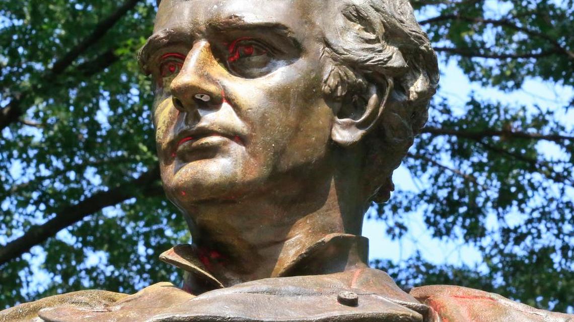A Central Park statue of Dr. J. Marion Sims is shown last weekend with red markings in the aftermath of vandalism in New York. Sims was known as the father of modern gynecology. But critics say his use of enslaved African-American women as experimental subjects was unethical.
