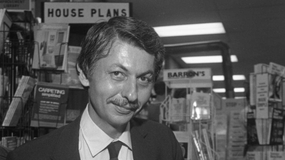 Journalist and author Jack Bass signs copies of of his book, Unlikely Heroes, at the Happy Bookseller in the Richland Mall in 1980.