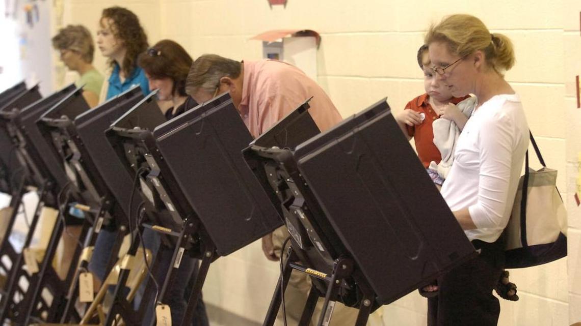 Voters line the machines at Precinct 8 at Myers Park Traditional School during a recent primary. DAVID T. FOSTER III-dtfoster@charlotteobserver.com