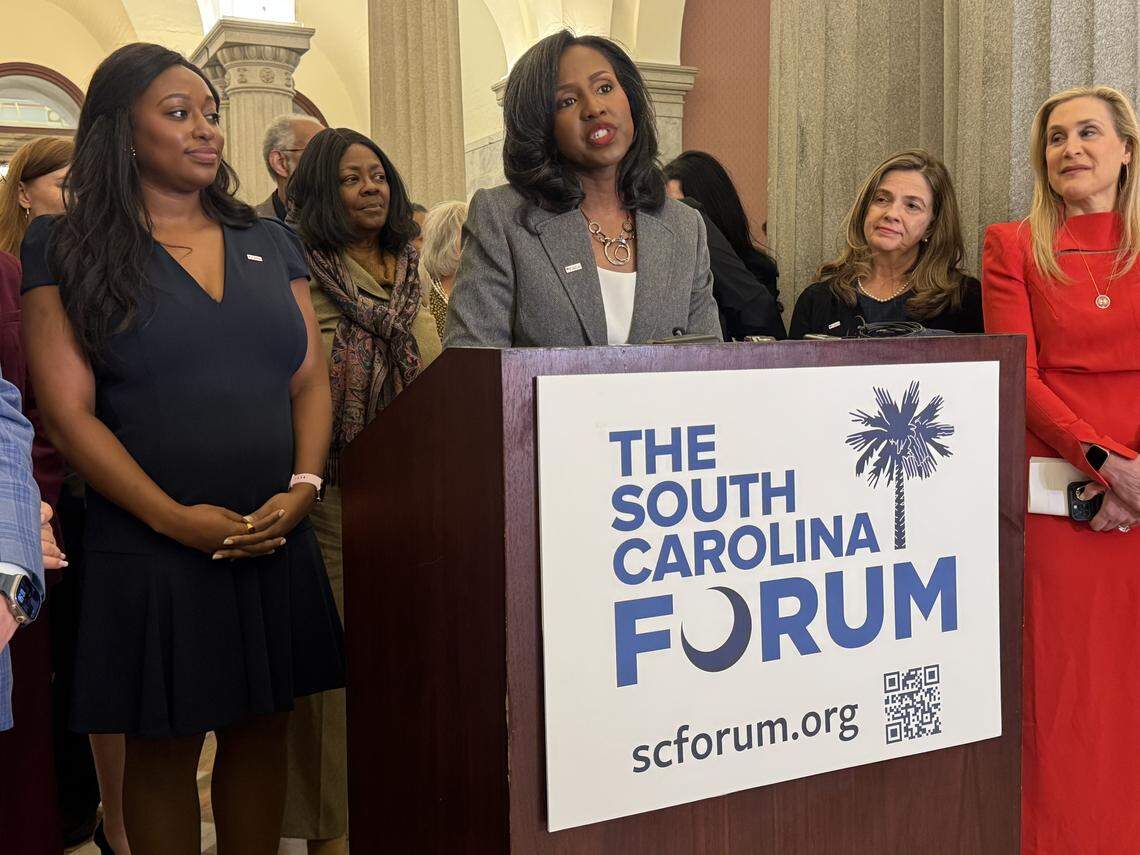 Michelle Brandt, left, a former SC Democratic Party vice chair, listens as Jennifer Cunningham, a Richland County Republican Party vice chair, speaks about the SC Forum initiative on Wednesday, Feb. 25, 2026.