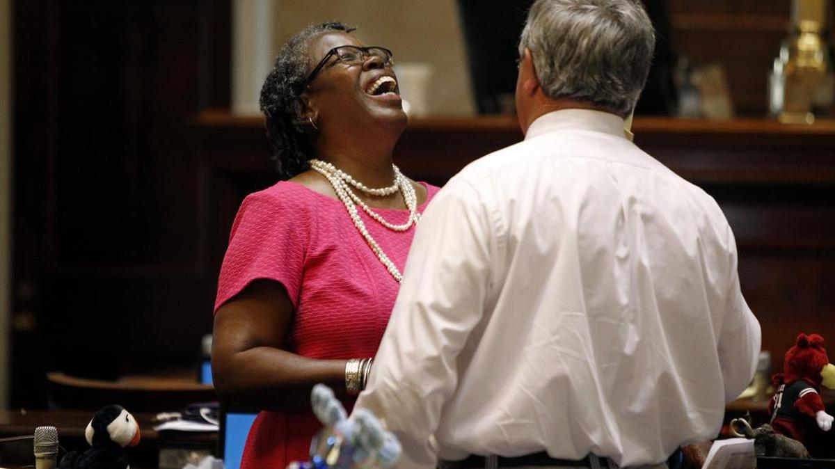 Rep. Gilda Cobb-Hunter, left, D-Orangeburg, laughs with Rep. Robert Ridgeway, D-Clarendon, on Thursday, the last day of the session for the Senate and House of Representatives at the South Carolina State House.