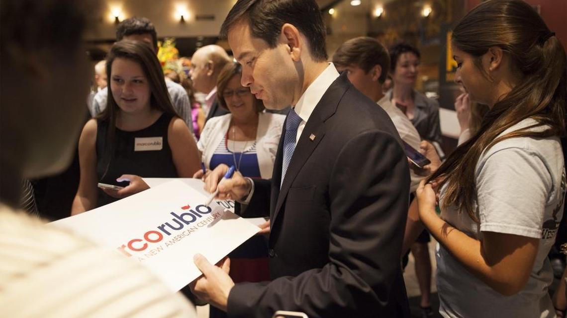 
U.S. Republican presidential candidate Marco Rubio signs political posters after speaking at a Horry County Republican Party breakfast at Rioz Brazilian Steakhouse in Myrtle Beach, August 28, 2015.
