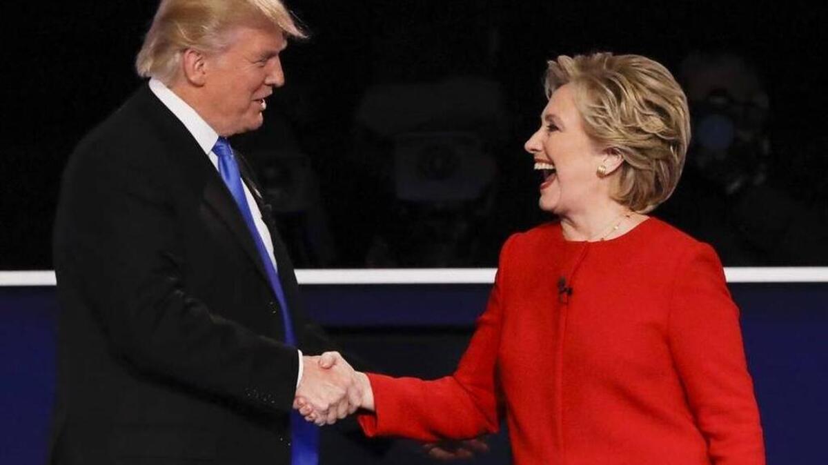 Republican presidential nominee Donald Trump shakes hands with Democratic presidential nominee Hillary Clinton after the presidential debate at Hofstra University in Hempstead, N.Y., Monday, Sept. 26, 2016.