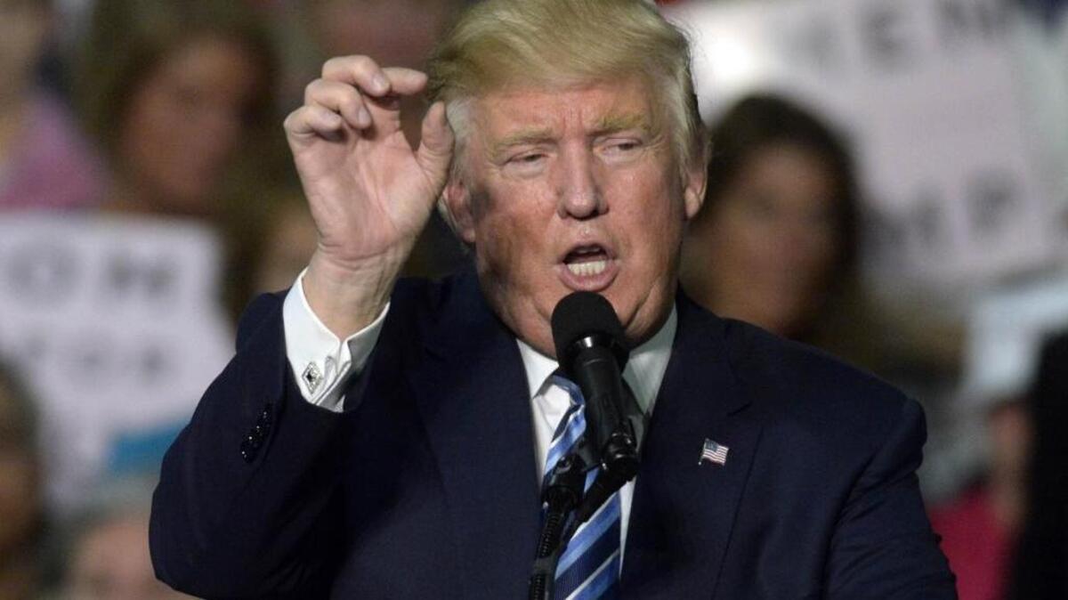 Republican presidential candidate Donald Trump talks to the crowd at a rally at the Charlotte Convention Center on Friday, October 14, 2016.