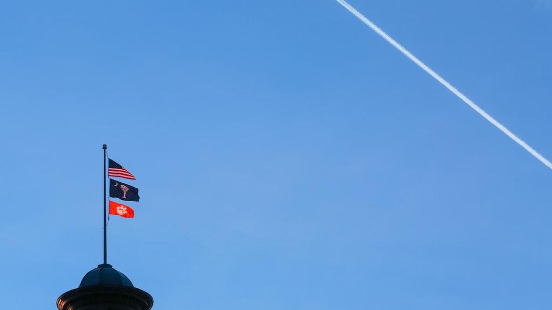 Once Clemson's football team clinched its first national championship in 35 years late Monday, an orange Tiger paw was raised over the dome of the SC State House.