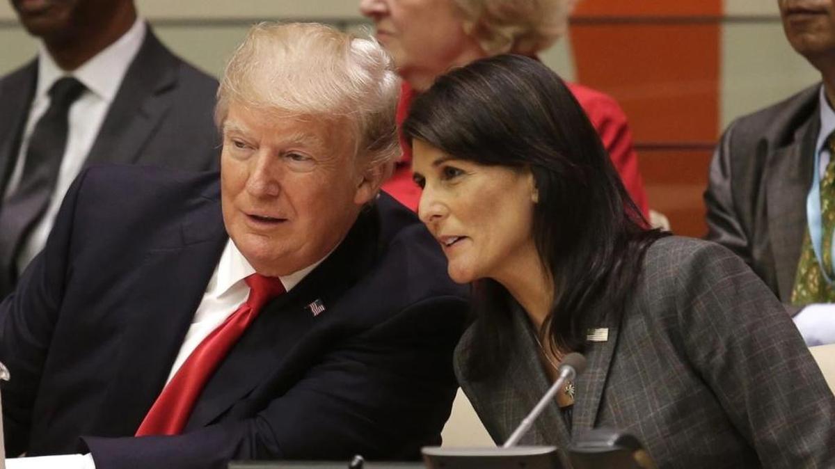 United States President Donald Trump speaks with U.S. Ambassador to the United Nations Nikki Haley before a meeting during the United Nations General Assembly at U.N. headquarters Monday.