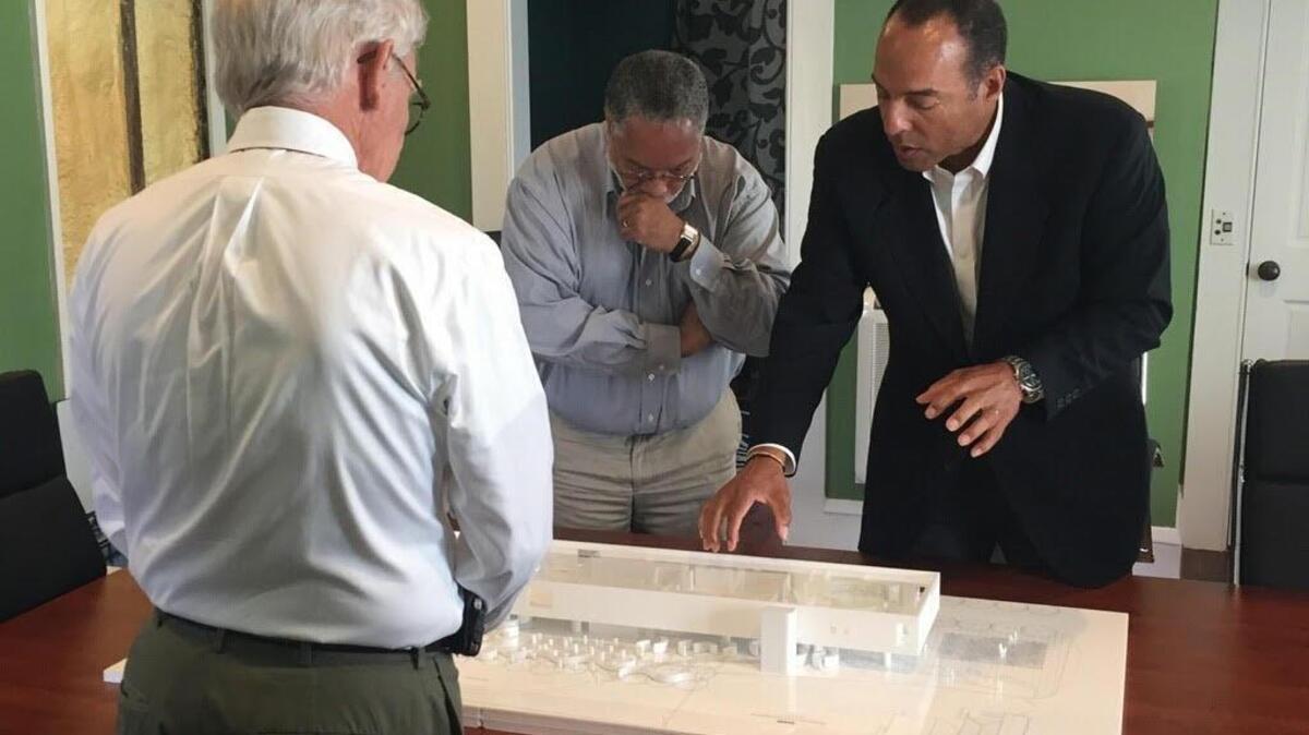 Michael Boulware Moore, president and CEO of the International African American Museum, Former Charleston Mayor Joseph P. Riley, Jr., and Lonnie Bunch, director of the National Museum of African American History and Culture, view the architectural model of the International African American Museum in Charleston.