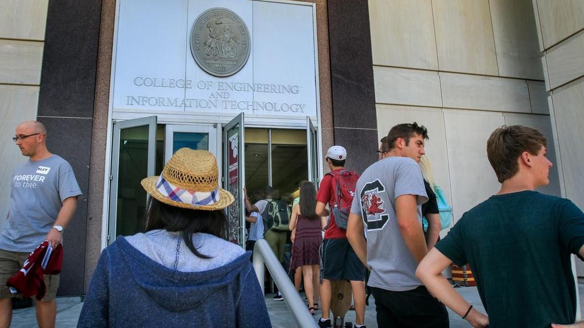 FILE: USC students wait outside the College of Engineering and Computing.