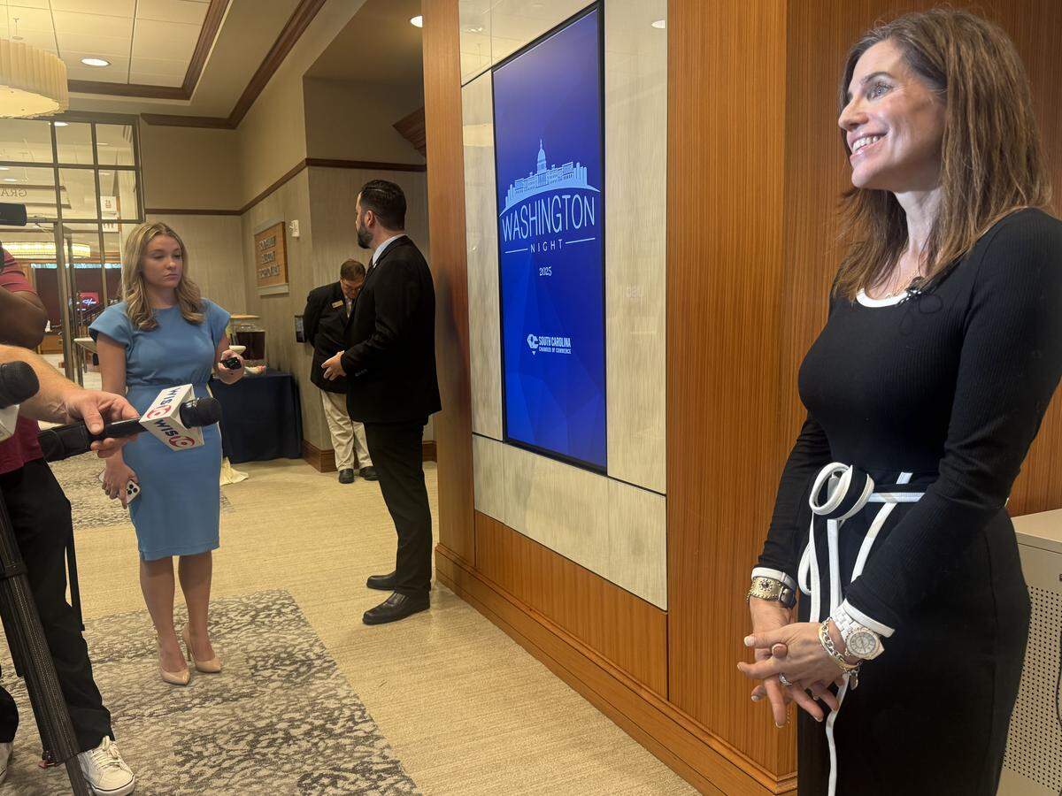Republican U.S. Rep. Nancy Mace speaks to the media at the South Carolina Chamber of Commerce’s Washington Night on Wednesday, Aug. 20, 2025 at the USC Alumni Center as her security stands nearby.