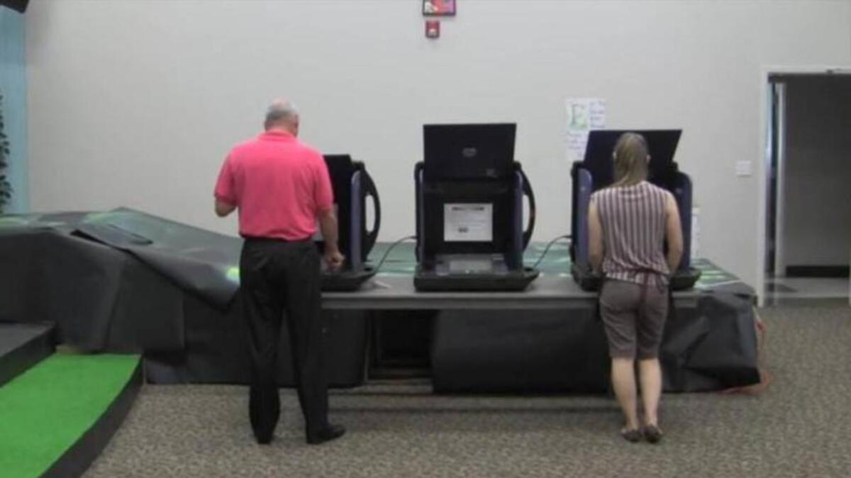Voters take part in the Republican runoff election between State Rep. Tommy Pope (R-York) and Ralph Norman at the River Hills Community Church in Lake Wylie.
