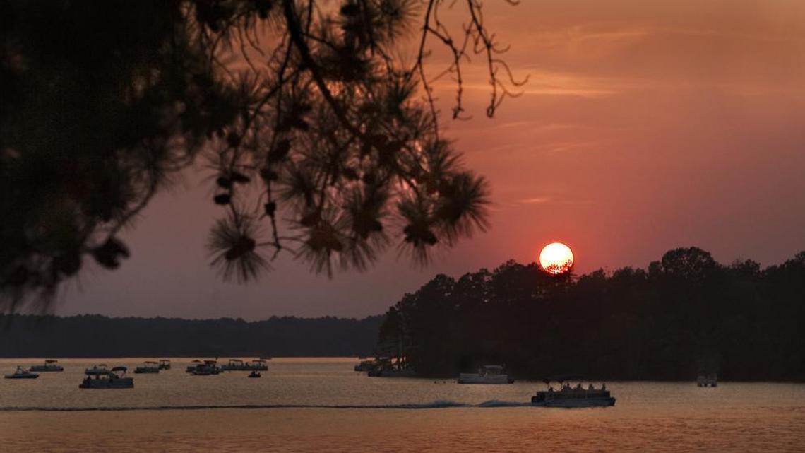 FILE: Boats gather in the waters of Lake Murray as the sun sets, to wait for the 4th of July fireworks.