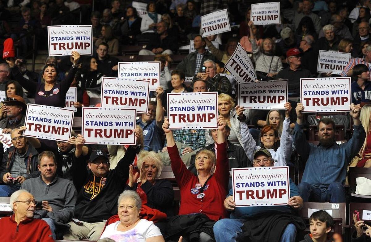 Donald Trump supporters hold up signs of support prior to rally at the Winthrop University Coliseum in Rock Hill, SC on Friday, January 8, 2016.