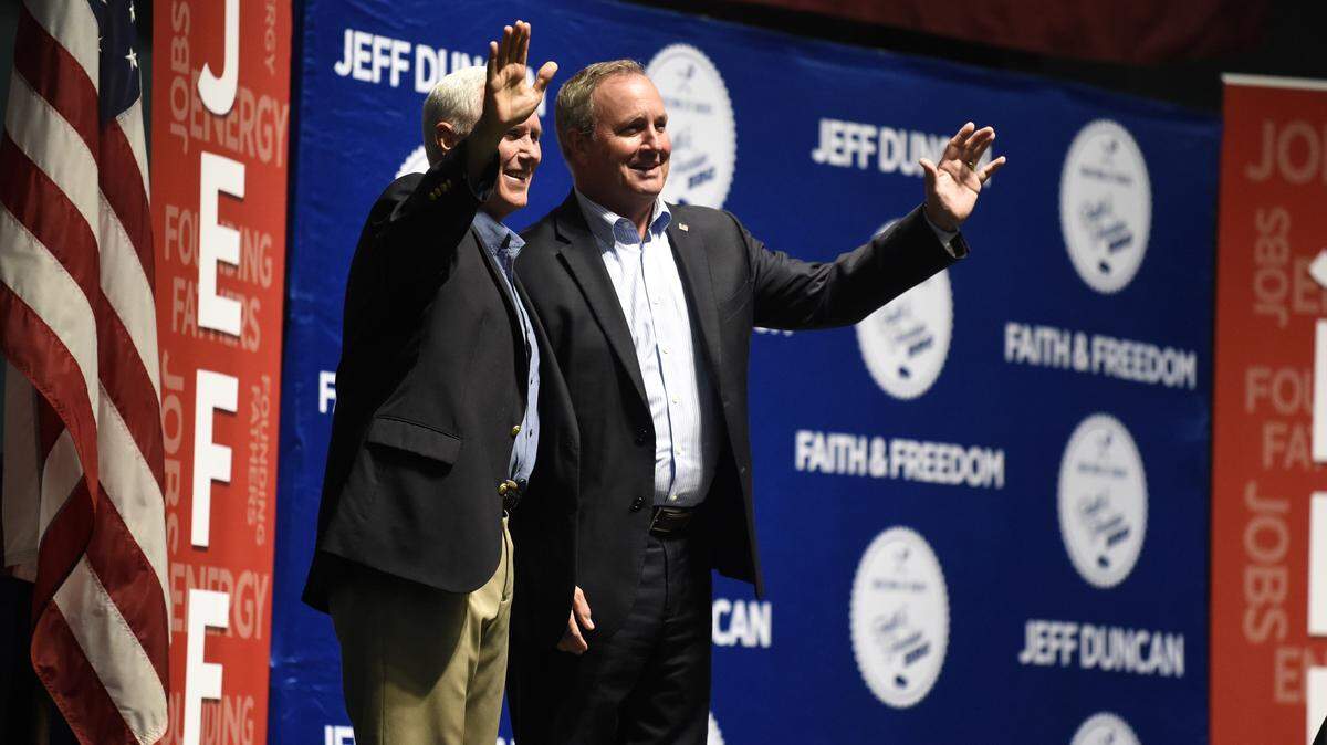 Vice President Mike Pence, left, stands next to U.S. Rep. Jeff Duncan on stage, Monday, Aug. 26, 2019, in Anderson, S.C. Pence was the headlining speaker at an annual fundraiser hosted by Duncan. (AP Photo/Meg Kinnard)