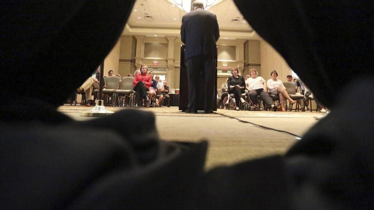 
The backdrop curtains puddle behind the podium as Republican presidential candidate Mike Huckabee talks to a gathering at Marina Inn at Grande Dunes on Tuesday. 
