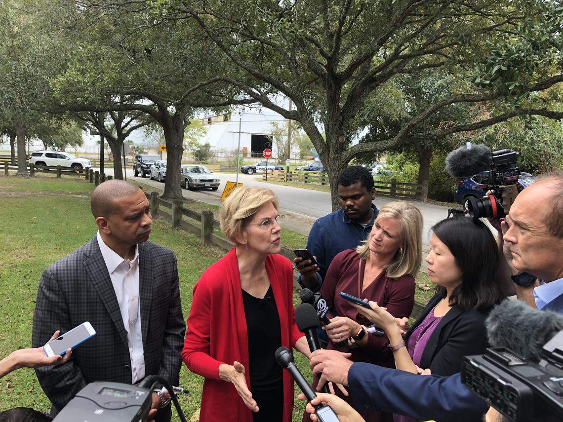 U.S. Sen. Elizabeth Warren, D-Massachusetts, speaks to reporters with state Sen. Marlon Kimpson, D-Charleston, in the Rosemont neighborhood in Charleston, S.C., on Wednesday, Oct. 9, 2019.