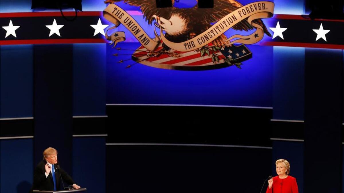 Republican presidential nominee Donald Trump and Democratic presidential nominee Hillary Clinton gesture during the presidential debate at Hofstra University in Hempstead, N.Y., Monday, Sept. 26, 2016.