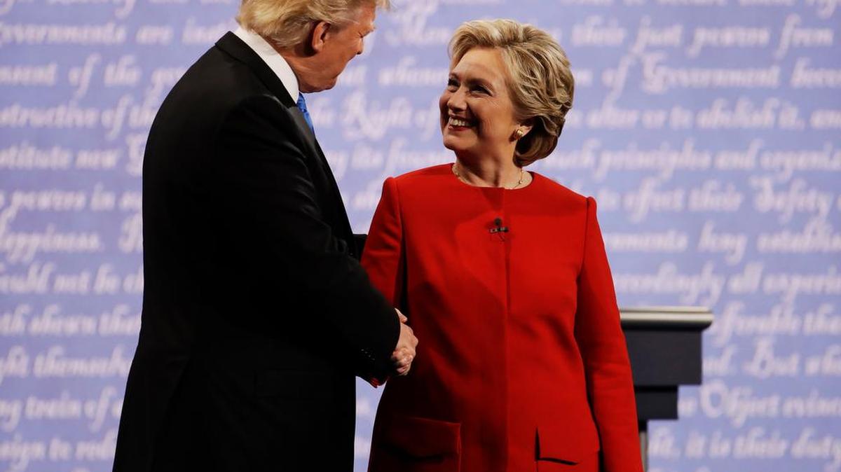 Democratic presidential nominee Hillary Clinton shakes hands with Republican presidential nominee Donald Trump during the presidential debate at Hofstra University in Hempstead, N.Y., Monday, Sept. 26, 2016.