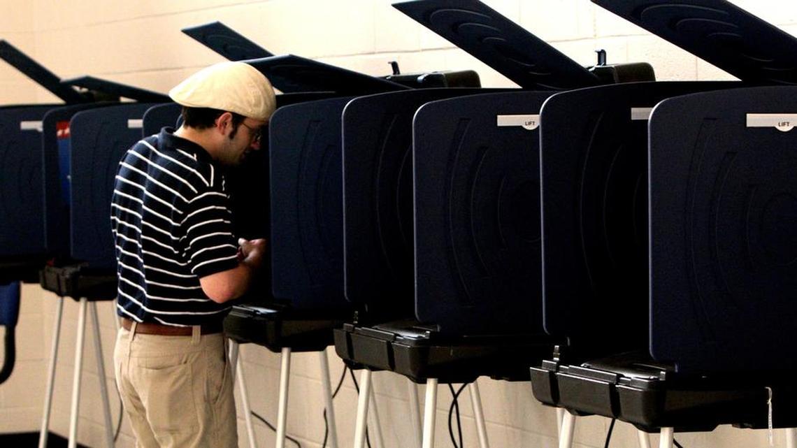 Michael Davis votes at the Hampton precinct at Kilbourne Elementary School.