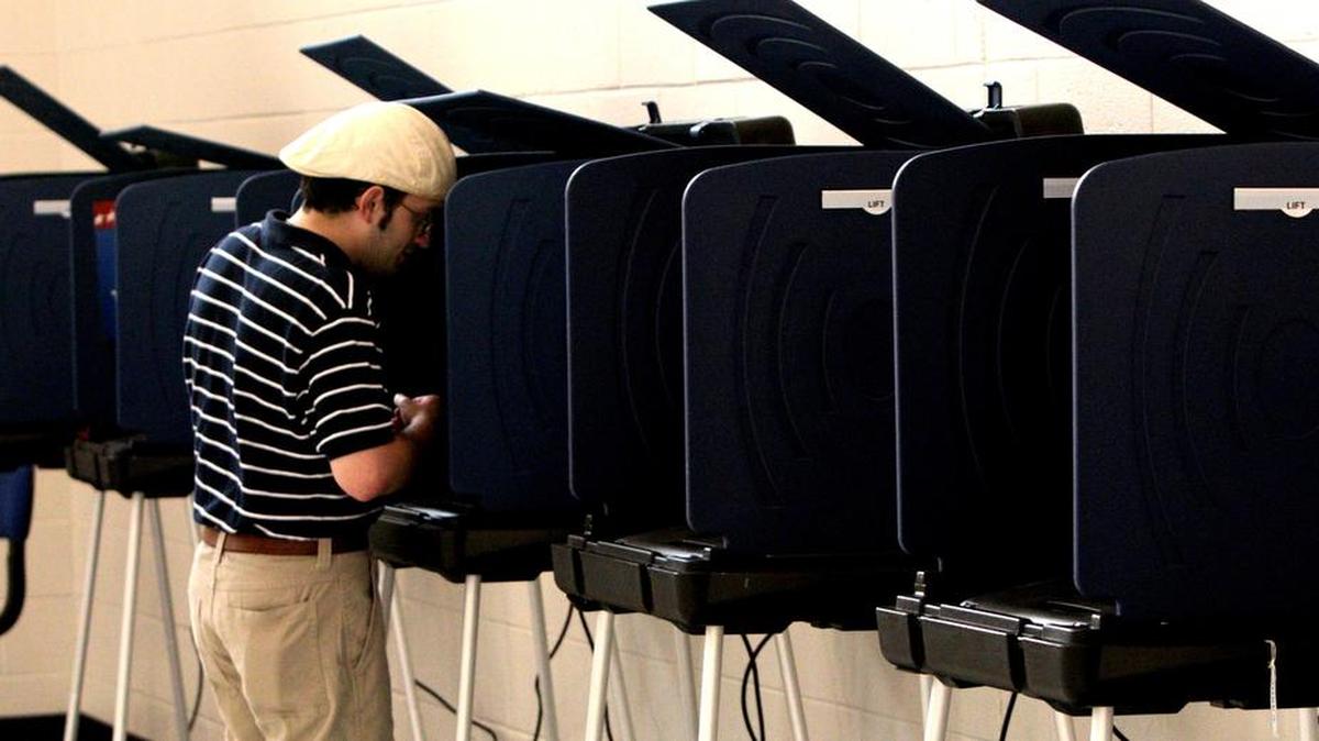 Michael Davis votes at the Hampton precinct at Kilbourne Elementary School.