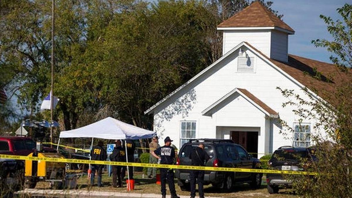 Law enforcement officials works at the scene of a fatal shooting at the First Baptist Church in Sutherland Springs, Texas, on Sunday, Nov. 5, 2017.