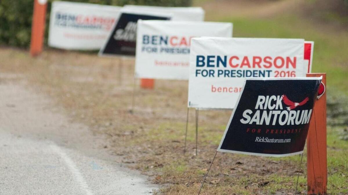 Signs for presidential hopefuls are shown at the South Carolina Tea Party Coalition Convention.