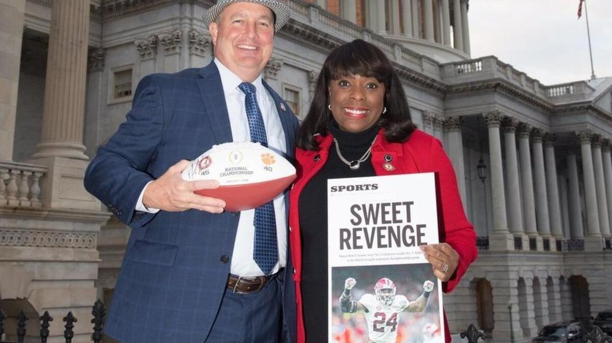 U.S. Representatives Jeff Duncan, left, and Terri A. Sewell, stand in front of the Capitol as the SC Republican makes good on a bet with the Alabama Democrat following Clemson’s loss to the Crimson Tide in a College Football Playoff semifinal game.