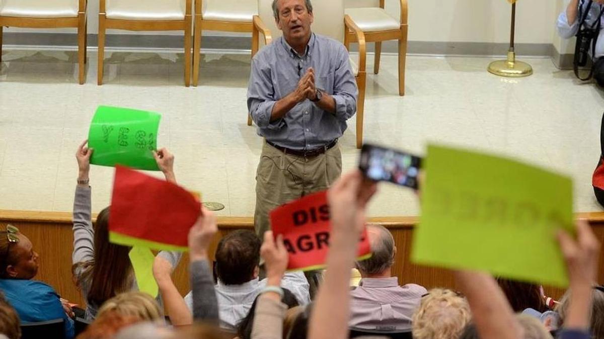 Rep. Mark Sanford answers questions during a town hall meeting at Technical College of the Lowcountry in Beaufort.