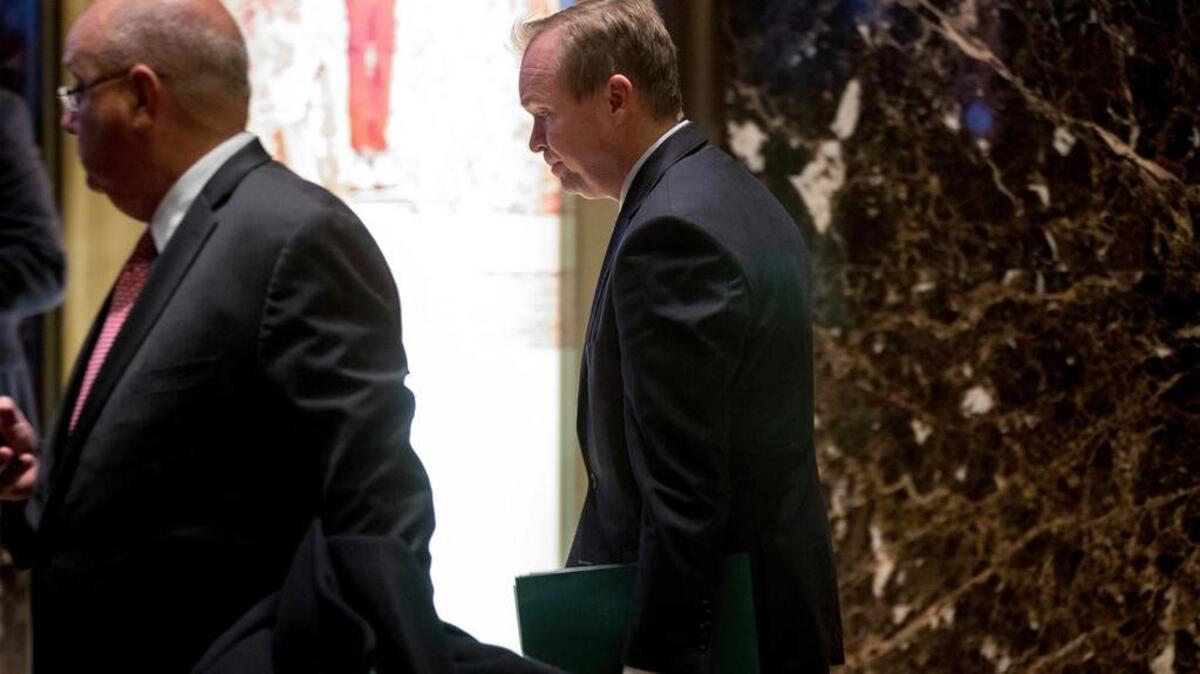 Rep. Mick Mulvaney, R-S.C., center, leaves Trump Tower, Monday, Dec. 5, 2016, in New York.