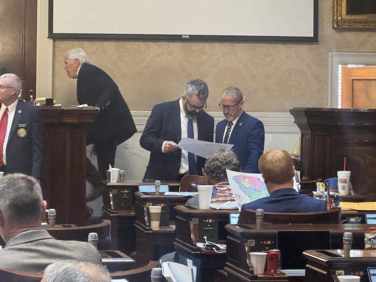 State Reps. Micah Caskey and Chris Wooten, Lexington County Republicans, look at proposed congressional map Thursday May 7, 2026, in the South Carolina state House.