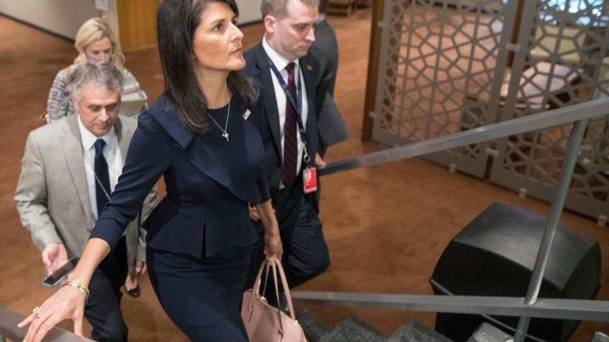 American Ambassador to the United Nations Nikki Haley, center, leaves after attending a Security Council meeting at United Nations headquarters.