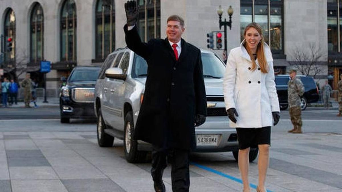Army Sgt. Maj. Greg Lowery, left, playing the part of President-elect Donald Trump, and Army Spc. Sara Corry, playing the part of Melania Trump, walk along the parade route during a dress rehearsal for Inauguration Day, Sunday, Jan. 15, 2017, in Washington.