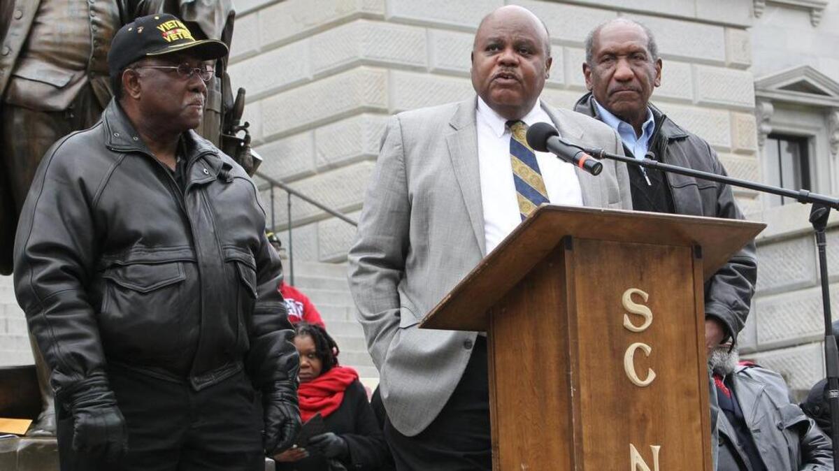State Reps, Lonnie Hosey, D-Barnwell, left, Joe Neal, D-Richland and Bill Clyburn, D-Aiken, speak during a rally on the Statehouse Steps to rally support to keep SC State University from shutting its doors for two years.