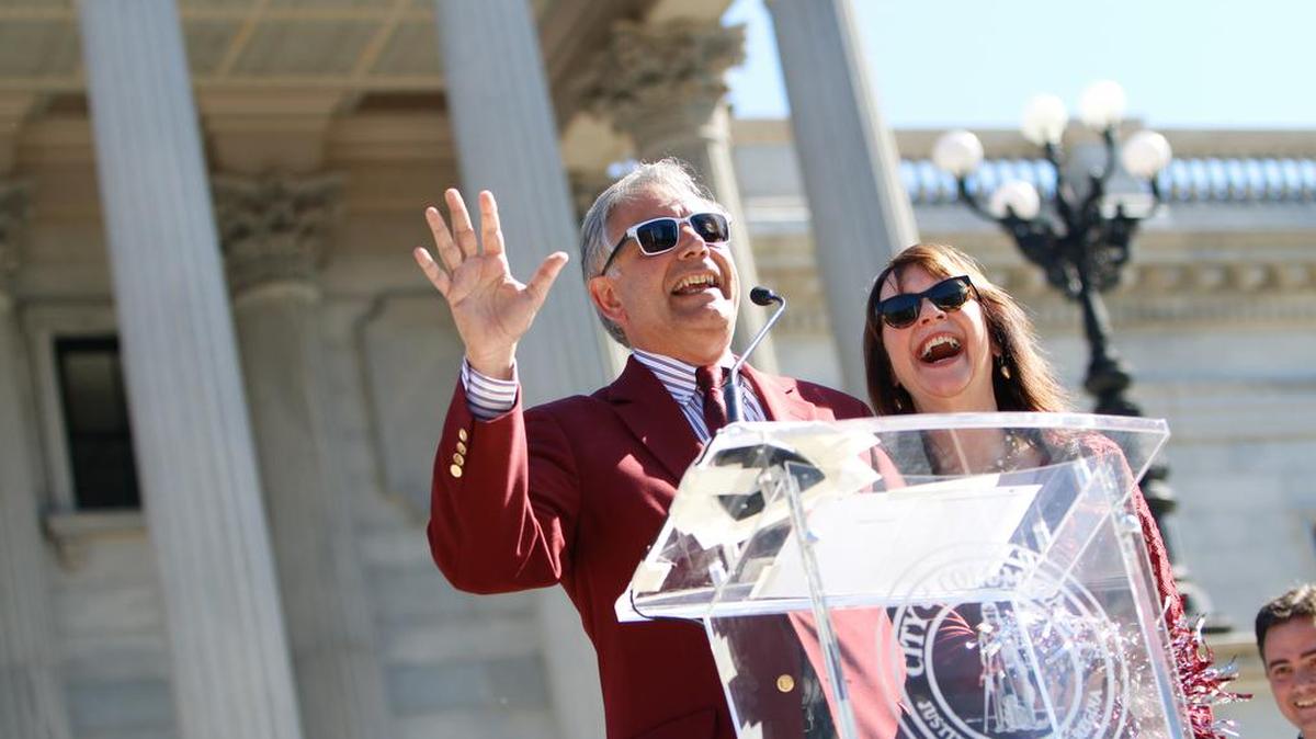 FILE: University of South Carolina President Harris Pastides and Patricia Moore-Pastides greet the crowd during a celebration and parade in downtown Columbia in honor of the National Championship University of South Carolina Women's Basketball Team.