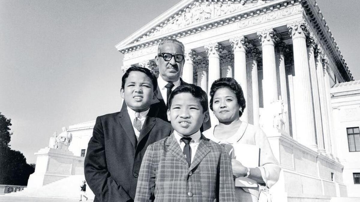 Supreme Court Justice Thurgood Marshall poses with his family outside the Supreme Court Building in Washington on Sept. 1, 1967. He is with his wife, Celia, and their two sons, Thurgood Jr. and John.