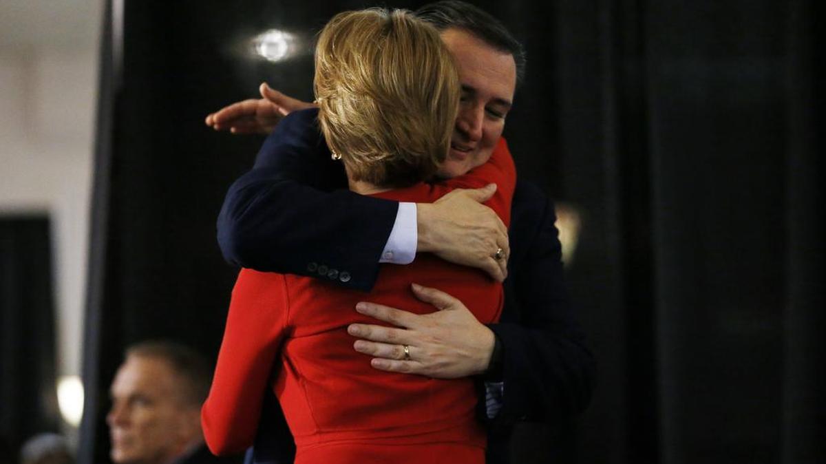 Republican presidential candidate Sen. Ted Cruz, back, R-Texas, hugs Carly Fiorina before speaking during a rally, Wednesday, April 20, 2016, at the Antique Automobile Club of America Museum in Hershey, Pa.