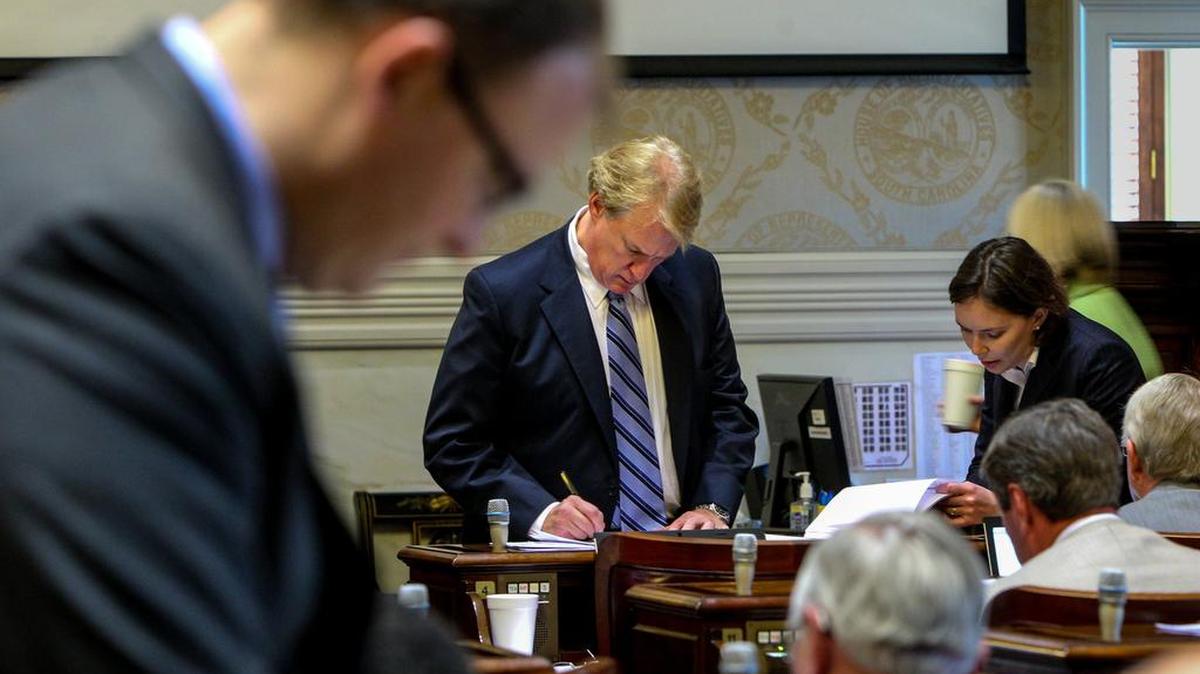 Former state Rep. Rick Quinn, Rep-Lexington, makes notes before discussing Emma's Law in the S.C. House in 2014. Quinn resigned in December just before pleading guilty to a public corruption charge.