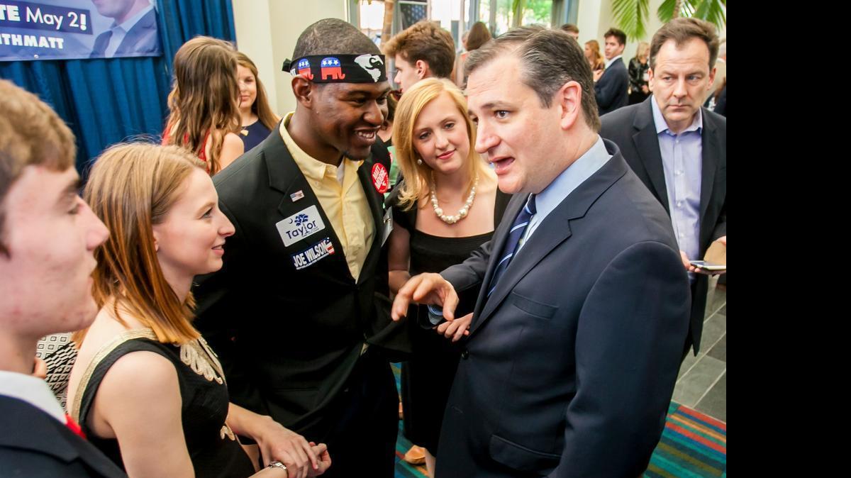 
U.S. Senator Ted Cruz chats with, from left, Jessie Totten, Byron Thomas and Madeline Mulkey at the South Carolina Republican Silver Elephant dinner at the Columbia Convention Center. 

