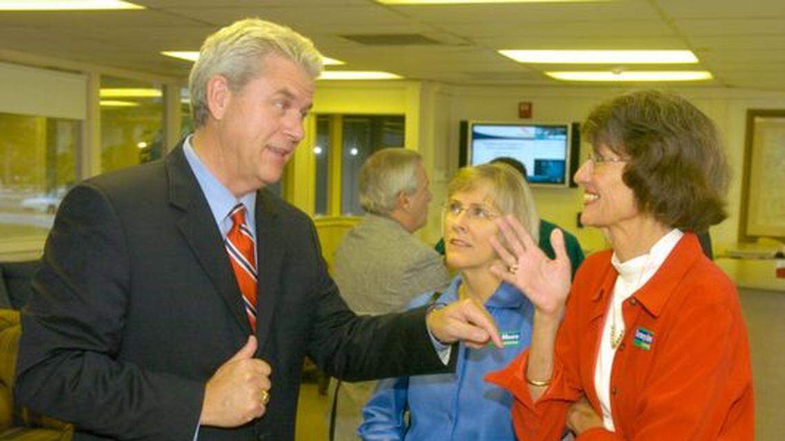 State senator Tommy Moore (left), the Democratic Gubernatorial nominee, talks with former congresswoman Liz Patterson (red jacket) after a campaign appearance at Greenville-Spartanburg Airport Wednesday, Oct 11, 2006.