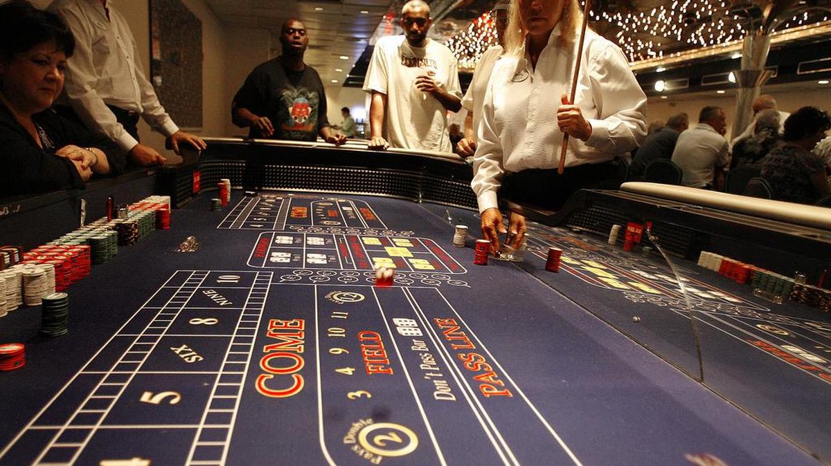Dice bounce on the craps table on a casino boat off the coast of Horry County in 2017. In October 2024, Horry County Council passed a new law that will charge casino boats more money per customer starting in 2025. 