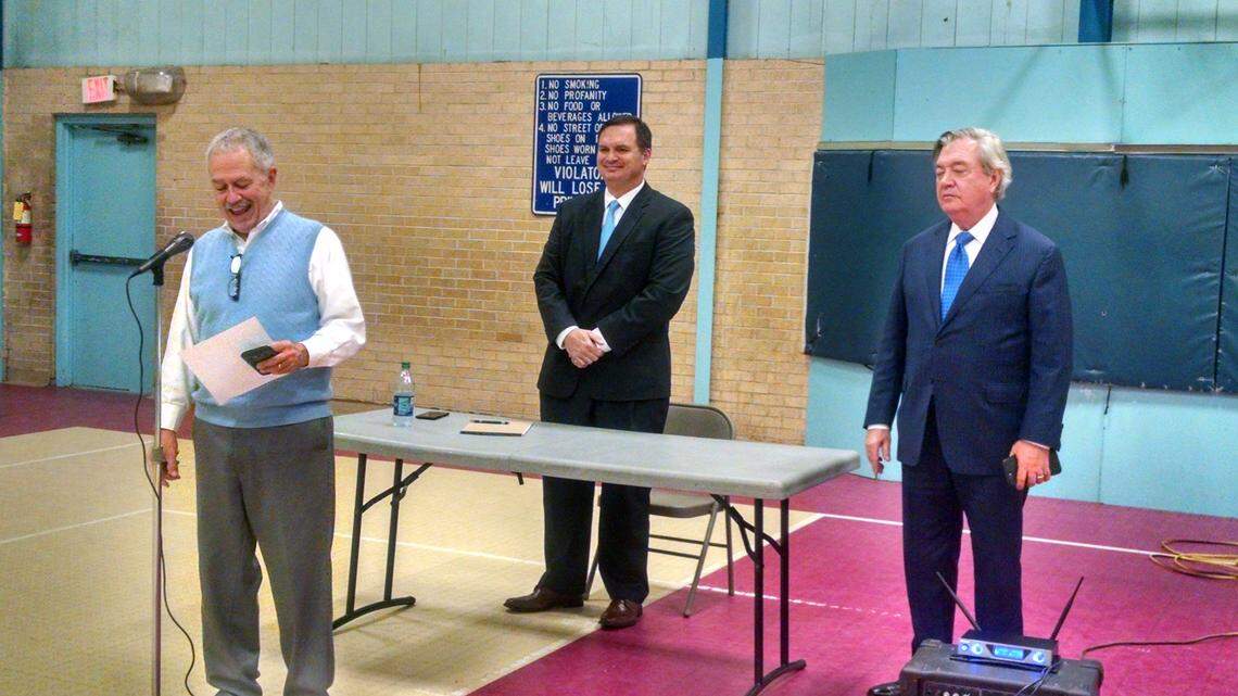 From left, moderator Earl Utsey with the South Meadowfield Neighborhood Association speaks at a debate between Republican Benjamin Dunn, center, and Democrat Dick Harpootlian at the Woodland Park Community Center.